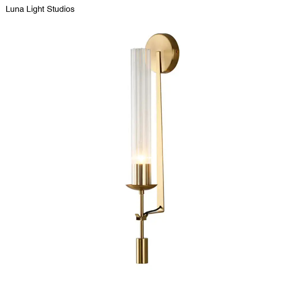 Modern gold wall sconce with clear glass shade bathroom light