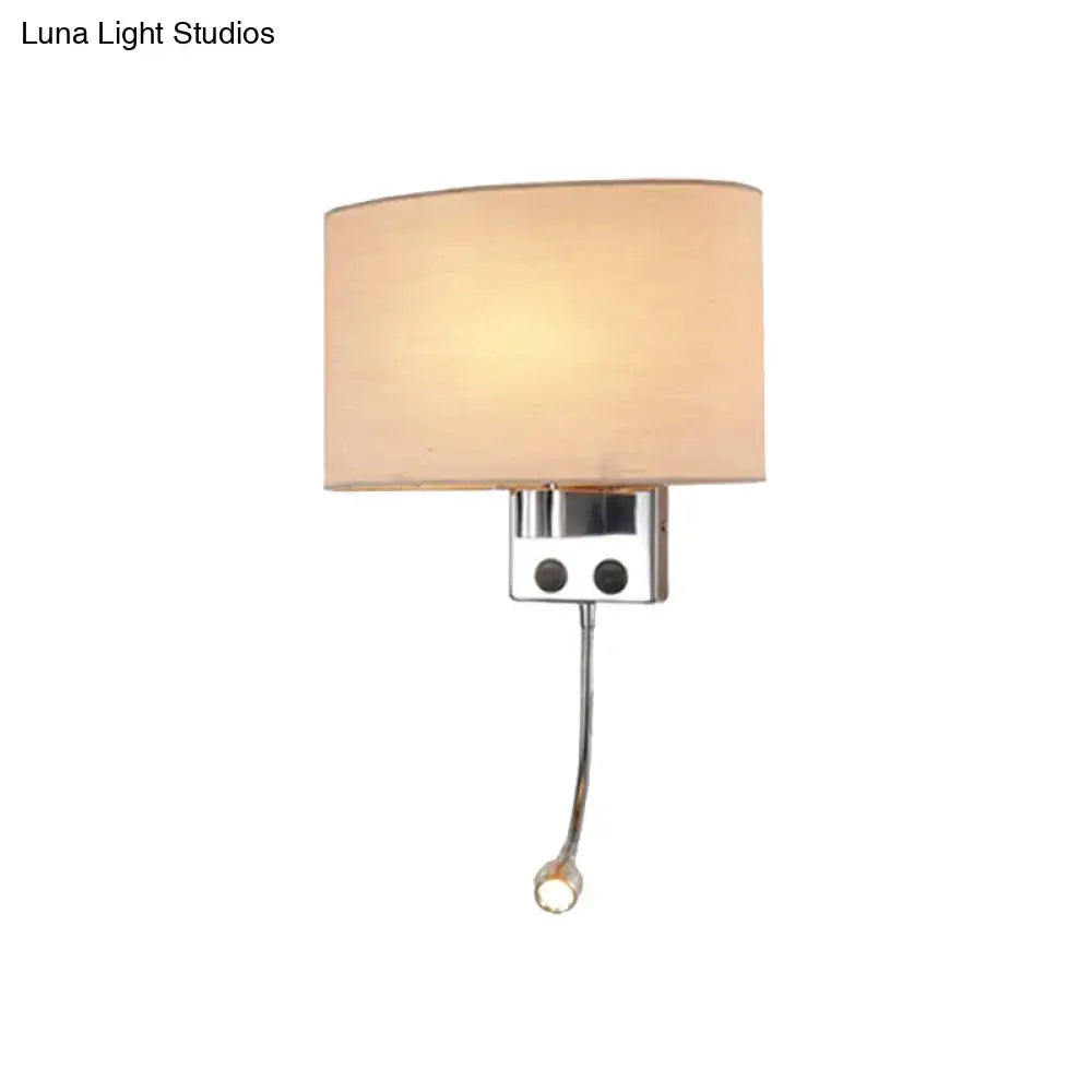 Modern gold wall sconce with cream fabric shade and chrome adjustable reading light approximately 12 inches tall