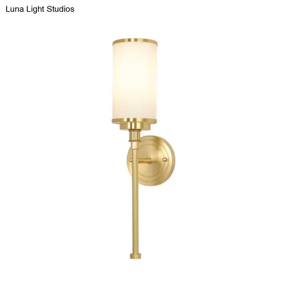 Modern gold wall sconce with milky glass shade for living room