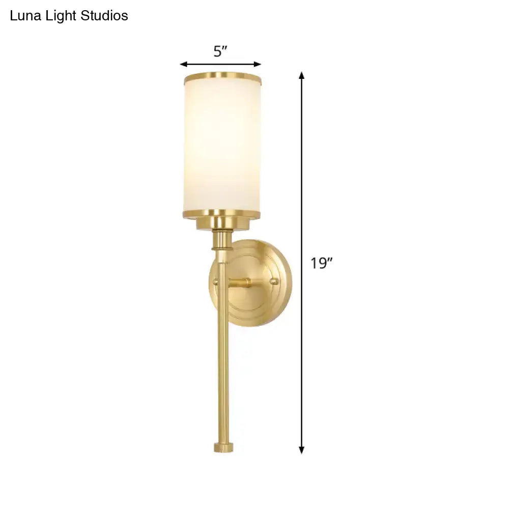 Modern gold wall sconce with milky glass shade for living room