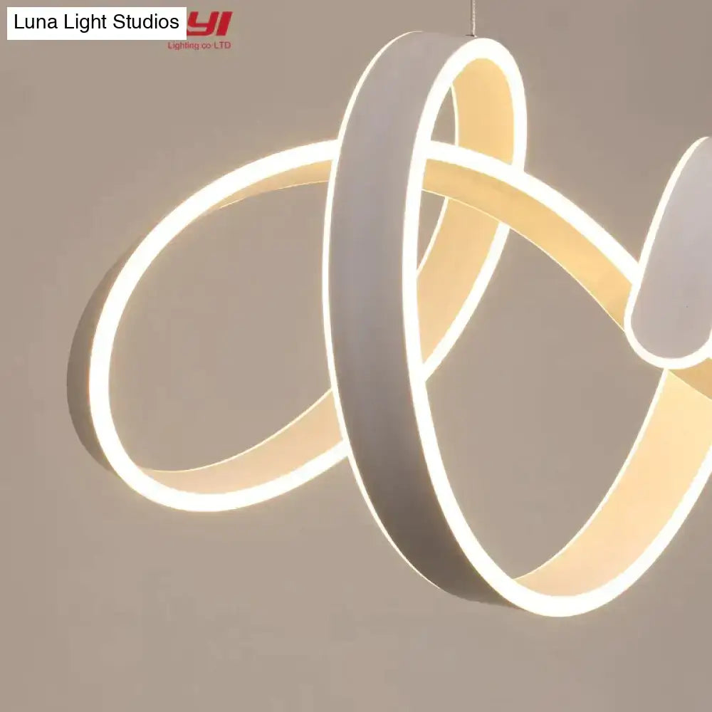 Modern gold and white led pendant lights featuring sleek infinity-loop white and beige illuminated rings for dining room
