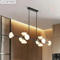 Modern black metal chandelier with frosted white glass flared shades and gold-toned accents for kitchen island lighting