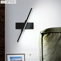Modern metallic black linear vanity wall sconce with a sleek angular design and slim profile for bathroom lighting