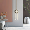 Modern minimalist bronze and white oval wall lamp with sleek curved arm and dark bronze fixture for bedroom lighting