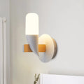 Modern minimalist white and wood wall lamp with frosted cylindrical shade and adjustable size range for bedroom wall light
