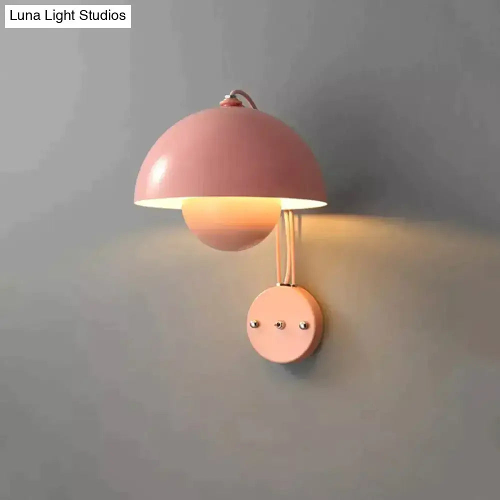 Pastel pink metallic modern mushroom wall lamp with dome-shaped shade and brass circular base type finish