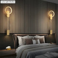 Modern nordic led black gold wall lamp with gold-toned circular sconces and cylindrical pendant lights for bedroom use