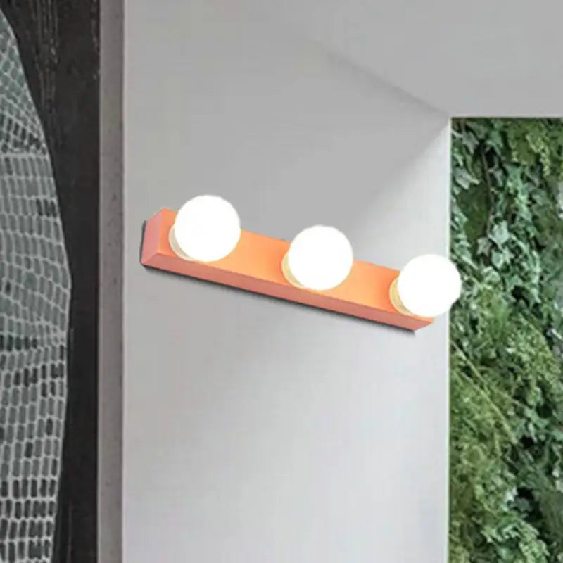 Modern orange & white 3 bulb vanity light fixture for bedroom