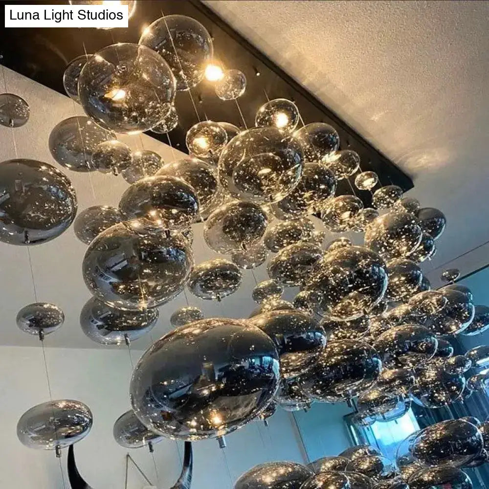 DecorBites™ modern oval bubble ball chandelier with transparent glass spheres and warm lights for dining room lighting