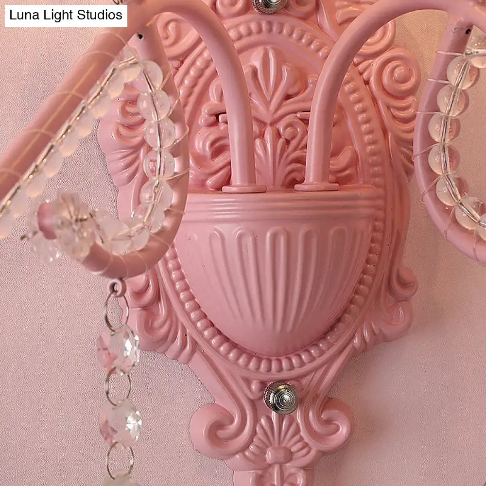 Modern pink metallic scroll arm wall lamp with crystal bedroom sconce