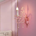 Modern pink metallic scroll arm wall lamp with crystal bedroom sconce