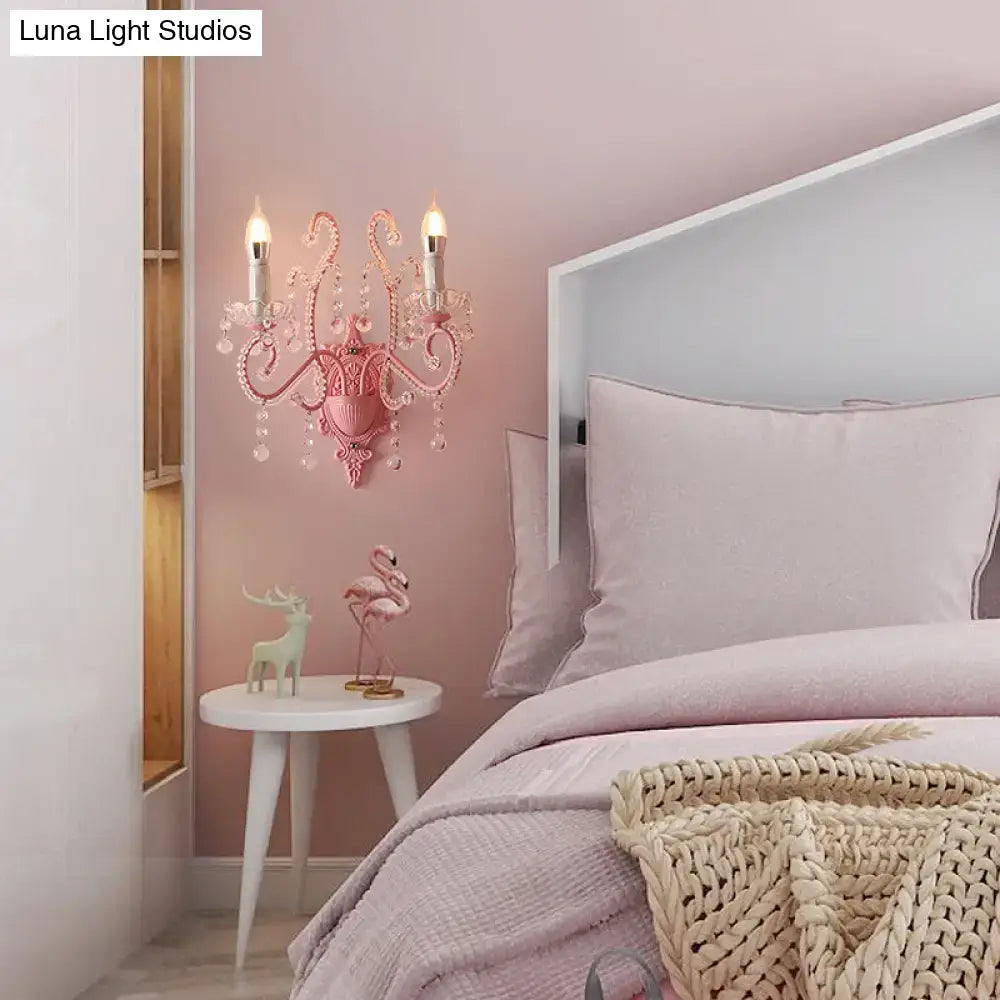 Modern pink metallic scroll arm wall lamp with crystal bedroom sconce
