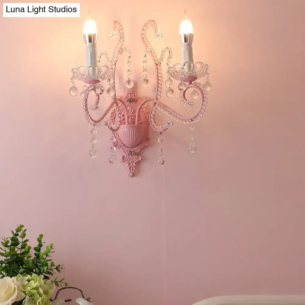 Modern pink metallic scroll arm wall lamp with crystal bedroom sconce