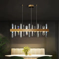 Modern rectangle gold crystal chandelier featuring clear prisms suspended from a sleek metallic frame by DecorBites™