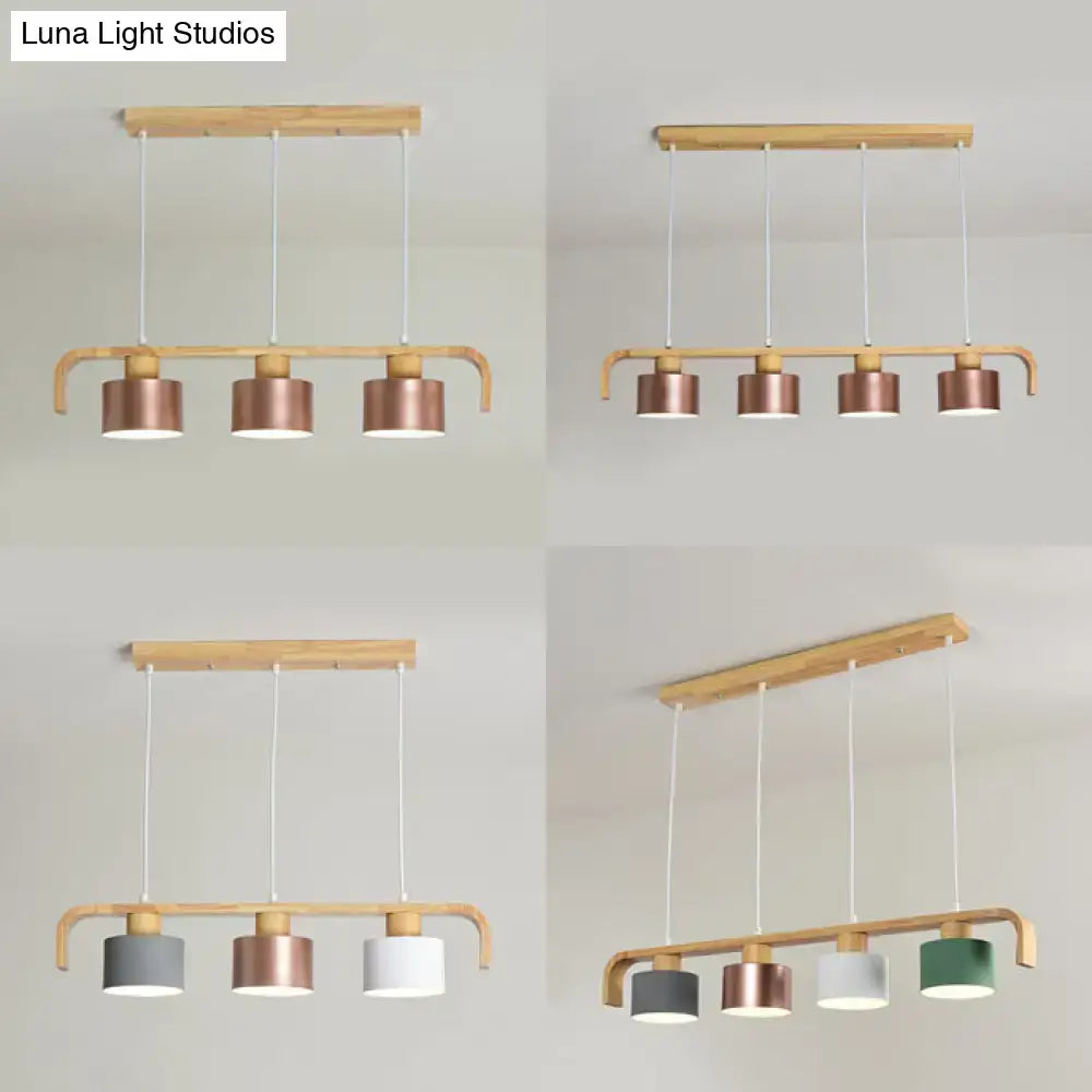 Modern rose gold drum island chandelier with wood dining room light