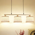 Modern silver and flaxen circle pendant light for kitchen island