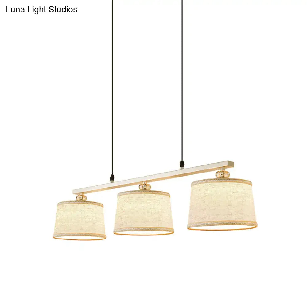 Modern silver and flaxen circle pendant light for kitchen island