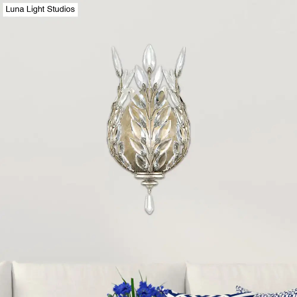 Modern silver & brass laurel wall light with crystal drop bedroom