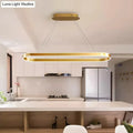 Gold-colored oval ceiling light with sleek modern design simplicity ellipse led island pendant for kitchen use