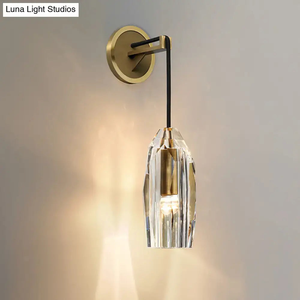 Modern single light brass wall sconce with clear crystal for bedroom