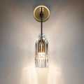 Modern single light brass wall sconce with clear crystal for bedroom