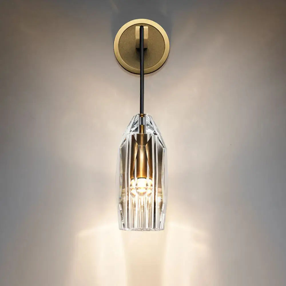 Modern single light brass wall sconce with clear crystal for bedroom