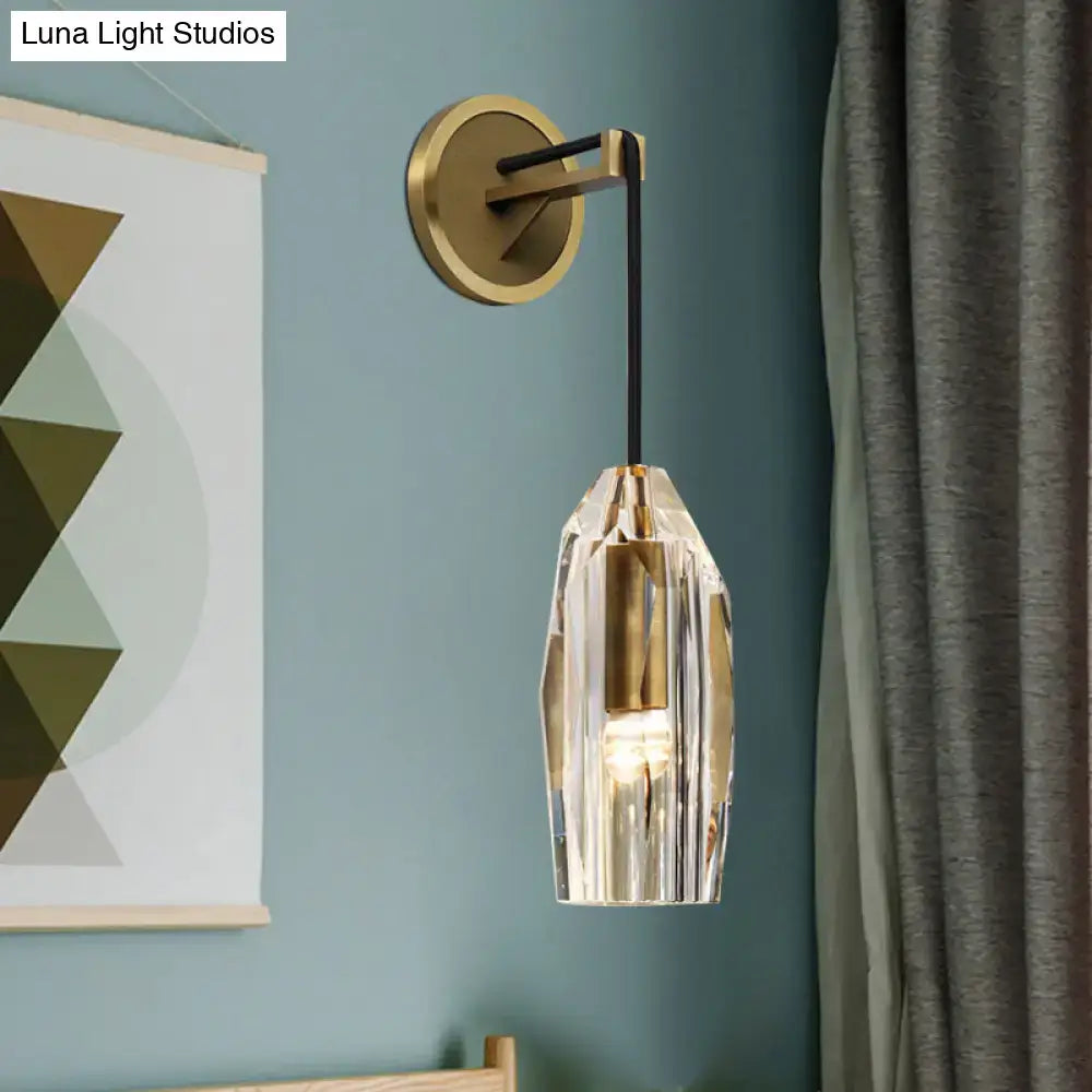 Modern single light brass wall sconce with clear crystal for bedroom