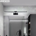 Modern style slender black led vanity light with warm white glow and compact shade height mounted above mirror