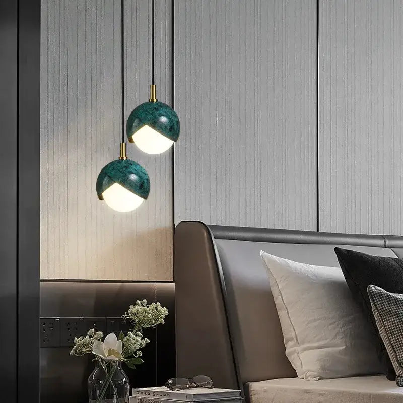 Modern teal glass and brass pendant light for kitchen island