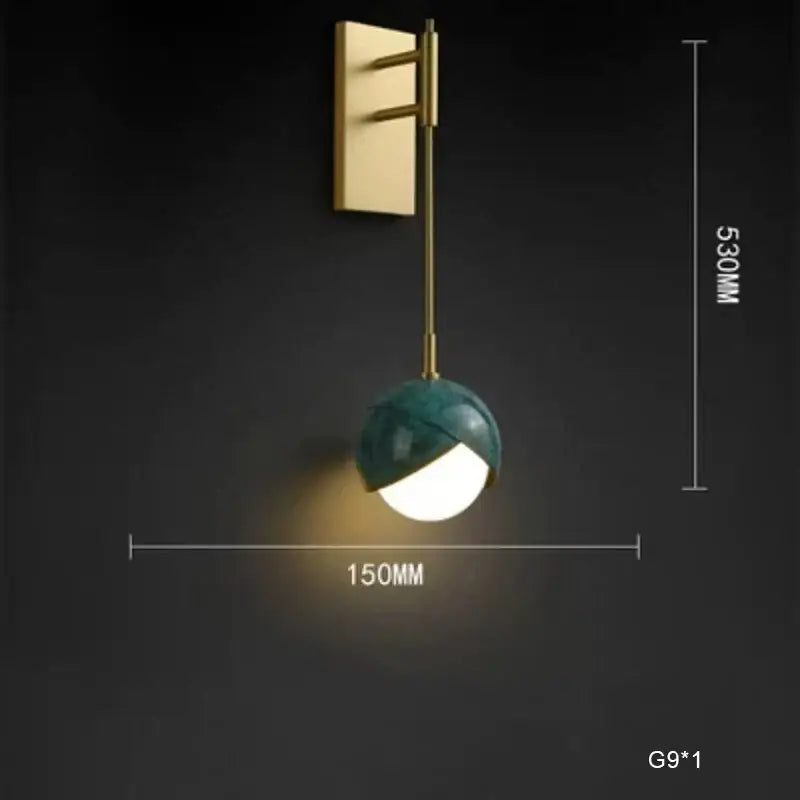 Modern teal glass and brass pendant light for kitchen island