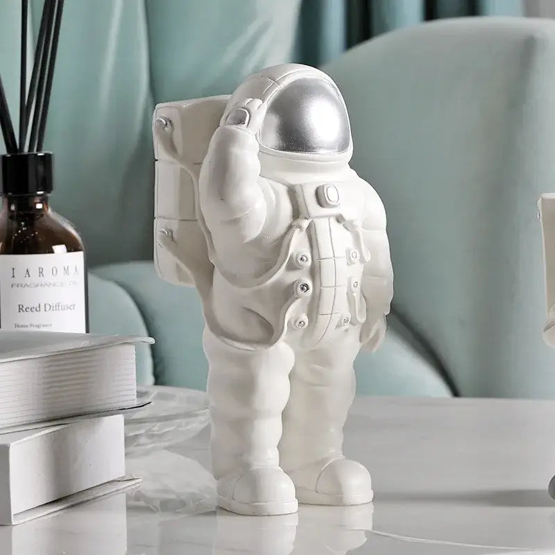 Modern white and gold astronaut phone holder living room figurine