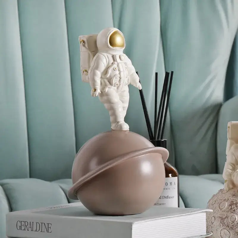 Modern white and gold astronaut phone holder living room figurine