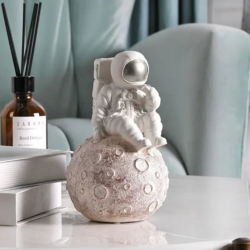 Modern white and gold astronaut phone holder living room figurine