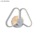 Modern white black led triangle wall sconce with sleek symmetrical design and warm ambient lighting for living room use