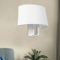 Modern white fabric sconce with a curved shade providing a sleek wall lighting idea for bedroom walls