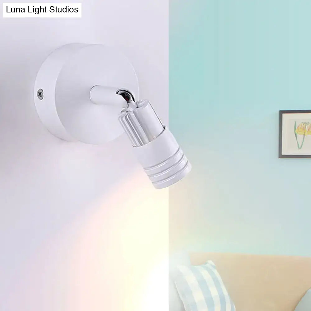 Modern white metal wall mounted led spotlight with adjustable design and metallic accents for bedroom reading light fixture