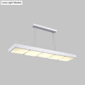 Modern white metal rectangular island lamp with four evenly spaced softly glowing panels for office use