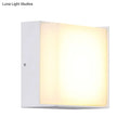 Modern white rectangular wall light with warm white diffused glow direct wired for hallway lighting