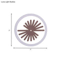 Modern white sector leaf pattern wall light with a circular white clock face and brown radial spokes for living room sconce