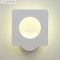 Modern white square led wall sconce with matte finish and circular cutout emitting warm natural light with color temperature