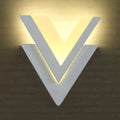 Modern white v-shaped led wall mounted light with warm led lighting ideal for bedroom wall mounted light decor