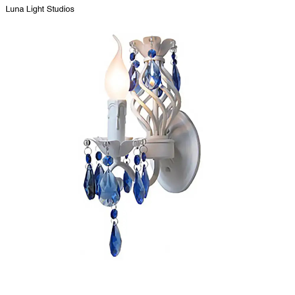 Modern white wall light with blue crystal draping bedroom sconce