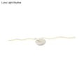 Modern white wave vanity light led wall sconce with a sleek wavy design and circular base for bathroom use