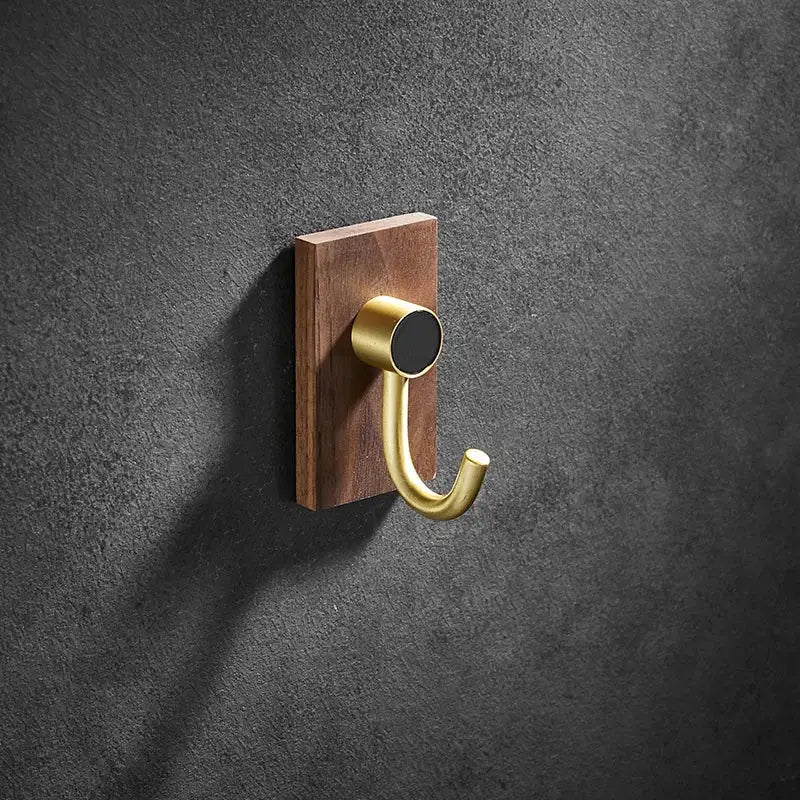 Modern wood and brushed gold wall hook row for kitchen
