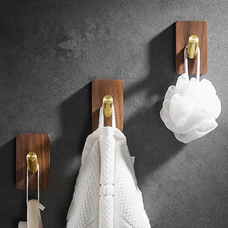 Modern wood and brushed gold wall hook row for kitchen