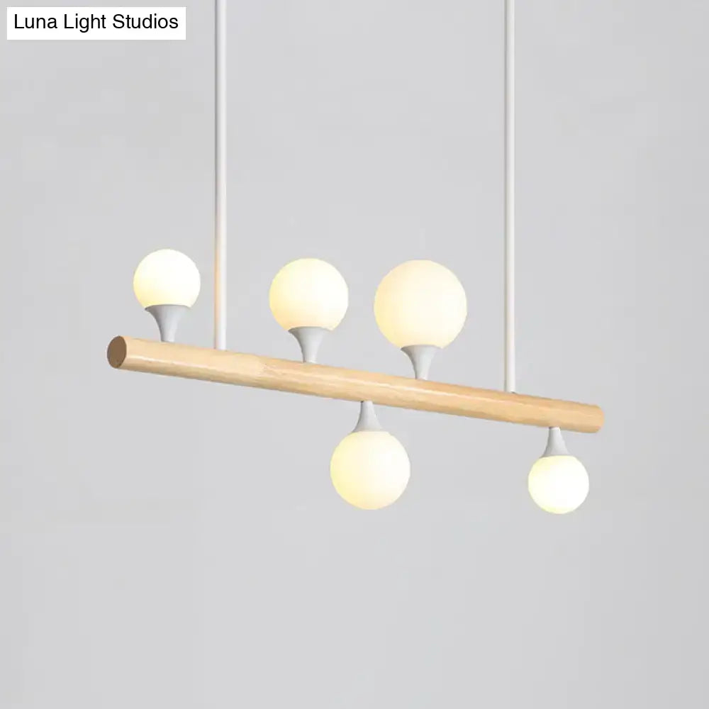 Modern wood island lamp with five globe lights dining room