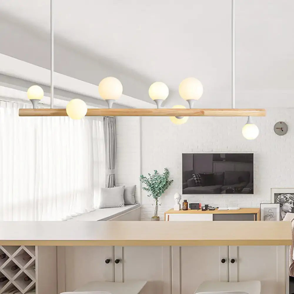 Modern wood island lamp with five globe lights dining room