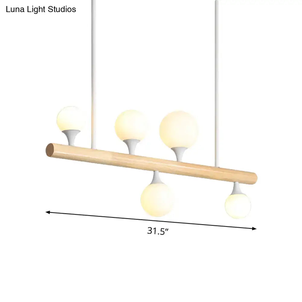 Modern wood island lamp with five globe lights dining room