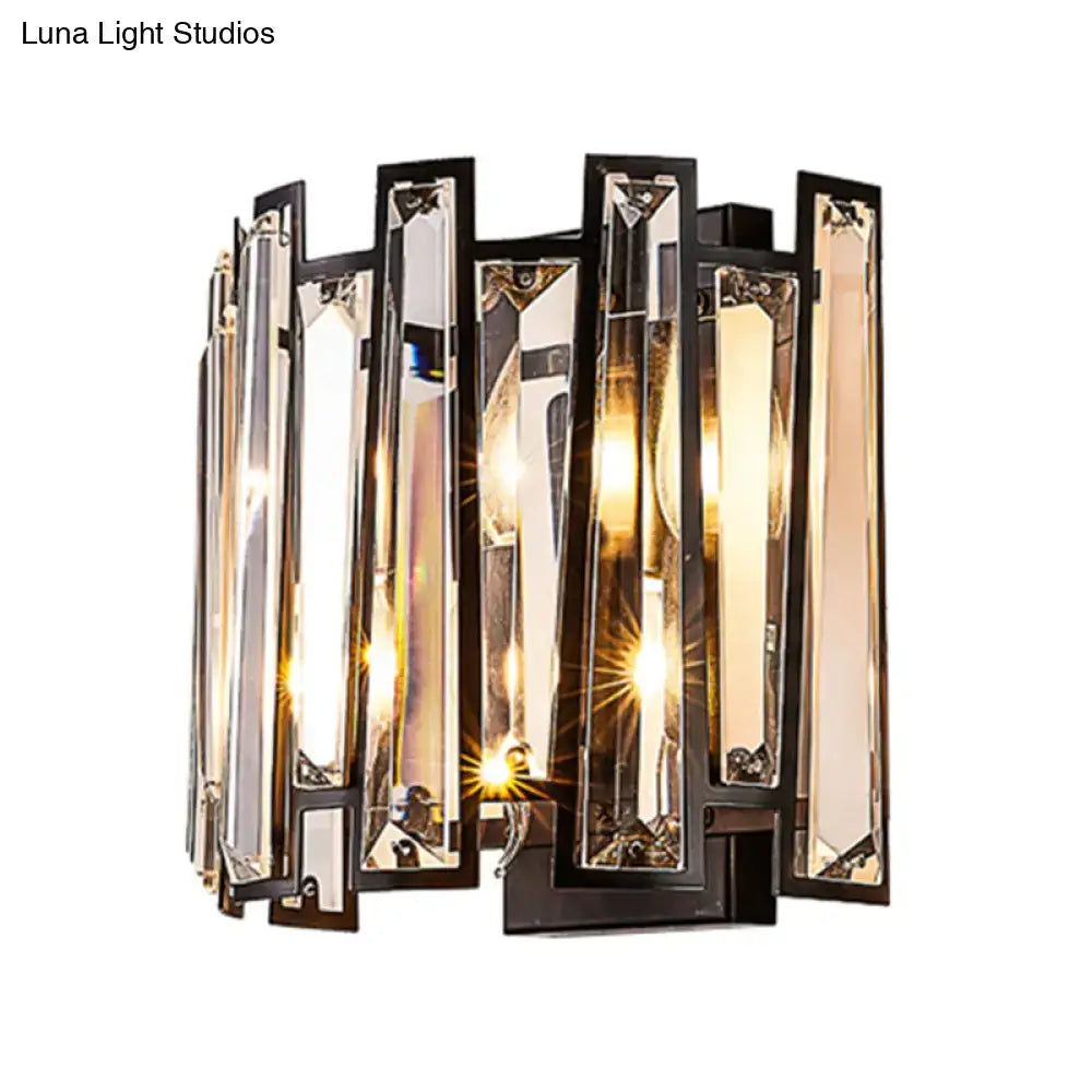 Modernist black finish wall lamp with vertical crystal bars refracting warm light for corridor lighting