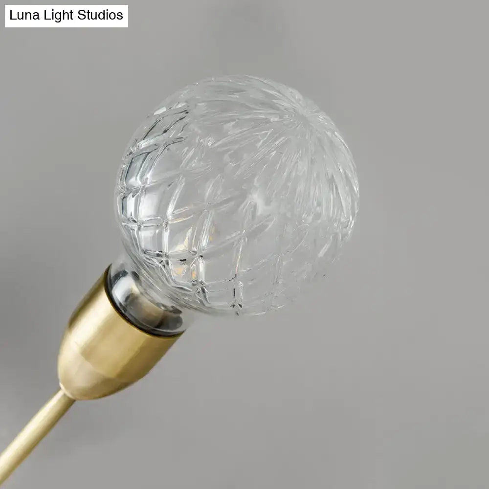 Modernist brass wall mount light fixture with prismatic glass bedroom